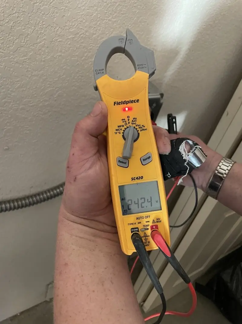 Voltage testing with clamp meter during Electrical Installation Services in Richland